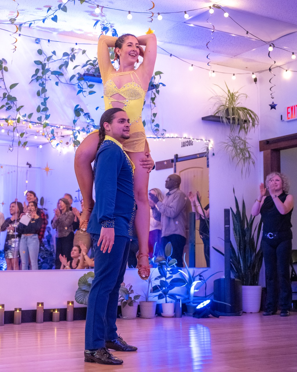 Couples learning salsa at Southern New Hampshire dance event